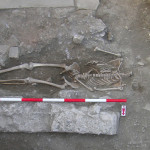 Figure 57. Grave (T347) cut into pavement preparation from narthex containing adult male 2957*.