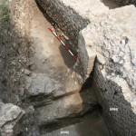 Figure 33. Drain [6106] on the north side of wall [6069].