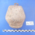 Figure 14. Large lead weight found within reoccupation layers of Room 4. 