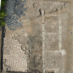Figure 28. Overview of charcoal deposits within the portico.
